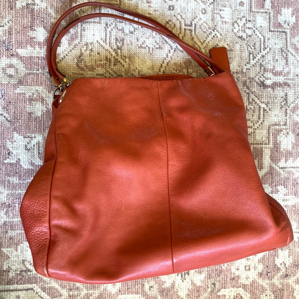 Coral/orange Coach purse